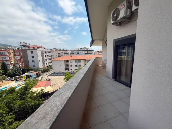 Фото объекта: Квартира 2+1 в Ünalan Sitesi, Аланья центр, меблированная, Центр (2)