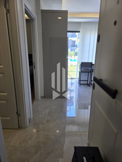 Spaciousness and comfort in a one-room apartment with a kitchen-living room in Gazipasa 10