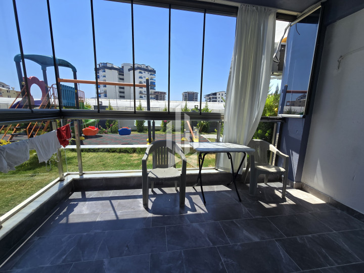 Spaciousness and comfort in a one-room apartment with a kitchen-living room in Gazipasa 11