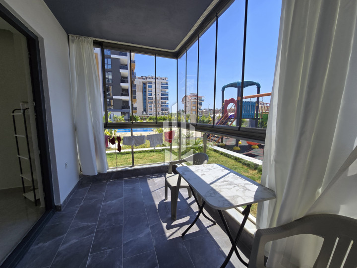 Spaciousness and comfort in a one-room apartment with a kitchen-living room in Gazipasa 12