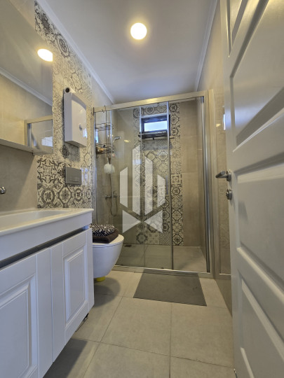 Spaciousness and comfort in a one-room apartment with a kitchen-living room in Gazipasa 13