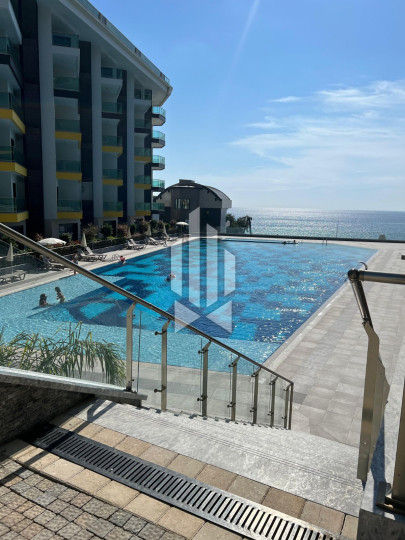 Сдается просторная и стильная квартира 2+1 в одном из лучших премиум-комплексов первой линии в Каргыджаке 10