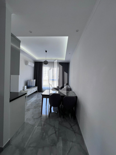 A cozy 1+1 apartment is for rent in a new and well-maintained complex in the Mahmutlar district 6