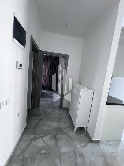 A cozy 1+1 apartment is for rent in a new and well-maintained complex in the Mahmutlar district 7