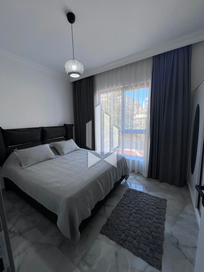 A cozy 1+1 apartment is for rent in a new and well-maintained complex in the Mahmutlar district 8