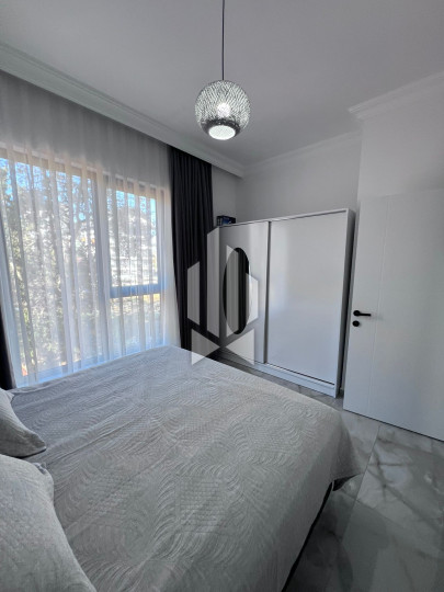 A cozy 1+1 apartment is for rent in a new and well-maintained complex in the Mahmutlar district 10