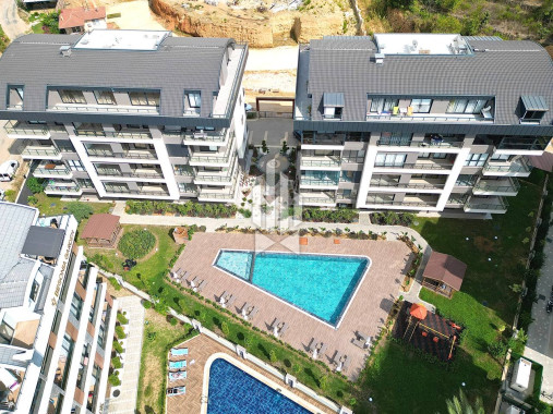 Новая квартира 1+1 в современном жилом комплексе, район Оба