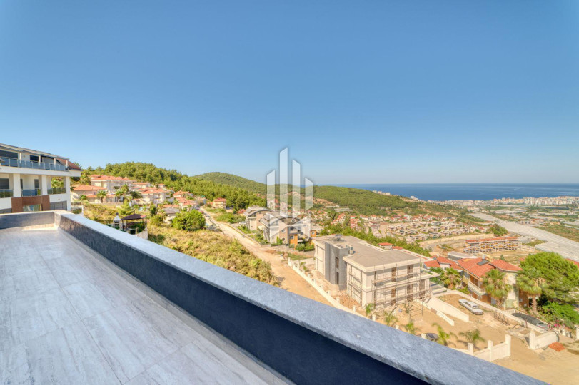 Luxury 4+1 villa with panoramic views of the sea and fortress in Kargicak 11