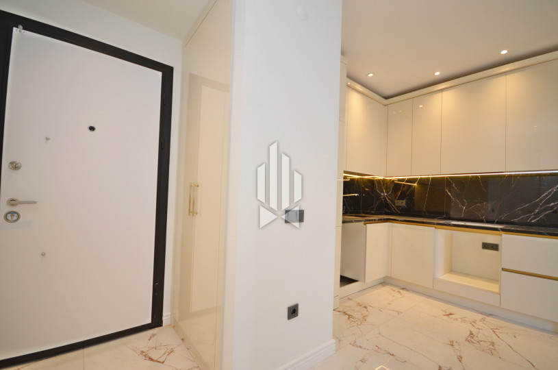 ПРОДАЁТСЯ НОВАЯ КВАРТИРА 1+1 С ВИДОМ НА БАССЕЙН В РАЙОНЕ OBA (АЛАНЬЯ) 9